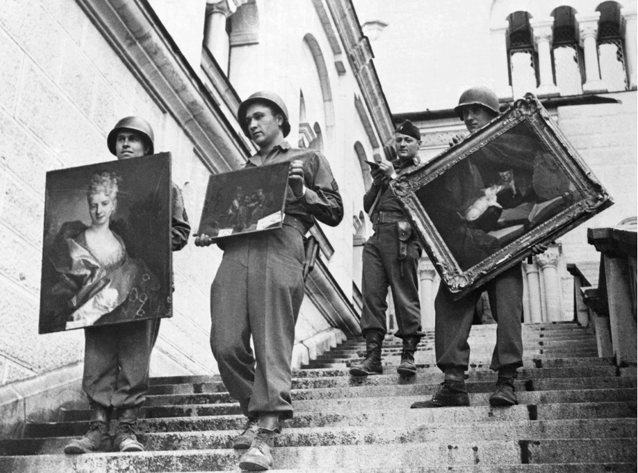 7th Army soldiers carrying three valuable paintings down the steps of Neunschwanstein Castle at Fussen, Germany, where they were a part of the collection looted by the Nazis from conquered countries. Bettmann/Getty Images Bettmann Archive.