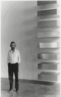 Donald Judd with his work, in 1982.